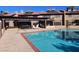 Community pool with BBQ and lawn chairs in condo complex at 4055 Nook Way # A, Las Vegas, NV 89103