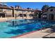 View of a community pool with condo buildings in the background at 4055 Nook Way # A, Las Vegas, NV 89103