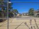 View of a tennis court with neighborhood buildings in the background at 4055 Nook Way # A, Las Vegas, NV 89103