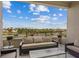 Balcony with outdoor seating and views of the surrounding landscape and skyline at 4288 Veraz St, Las Vegas, NV 89135