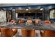 Stylish indoor bar with countertop seating that opens to the outdoor lounge area and stunning city views at 4288 Veraz St, Las Vegas, NV 89135