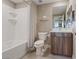 Well-lit bathroom featuring a shower-tub combo, single sink vanity, and tile flooring at 4288 Veraz St, Las Vegas, NV 89135