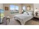 A bright and cozy bedroom with large windows, soft lighting, and minimalist decor to create a serene atmosphere at 4288 Veraz St, Las Vegas, NV 89135
