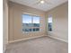 Bedroom with carpet, a ceiling fan, and large windows that let in natural light at 4288 Veraz St, Las Vegas, NV 89135