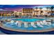 Beautiful community pool featuring lounge chairs and a stunning sunset view at 4288 Veraz St, Las Vegas, NV 89135