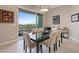 Stylish dining room with seating for six, views of the mountains, and modern artwork at 4288 Veraz St, Las Vegas, NV 89135