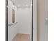 A residential elevator featuring neutral wall color, a tiled floor, and a stainless steel control panel at 4288 Veraz St, Las Vegas, NV 89135