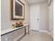 Inviting foyer featuring tile flooring, a console table with decor, and a contemporary artwork at 4288 Veraz St, Las Vegas, NV 89135