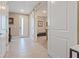 Welcoming entryway featuring neutral tones, tile flooring, and a sliding barn door at 4288 Veraz St, Las Vegas, NV 89135