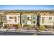 View of modern homes with desert landscaping, brick driveways, and attached garages at 4288 Veraz St, Las Vegas, NV 89135