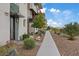 Stylish townhome with meticulously landscaped front yard featuring desert plants, rock details, and a welcoming walkway at 4288 Veraz St, Las Vegas, NV 89135