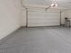 Spacious two car garage with epoxy flooring and an automatic door at 4288 Veraz St, Las Vegas, NV 89135