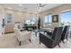 Bright living room featuring tile floors, comfortable seating, recessed lighting, and plentiful windows at 4288 Veraz St, Las Vegas, NV 89135