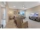 Comfortable living room featuring neutral walls, a ceiling fan, and plush seating at 4288 Veraz St, Las Vegas, NV 89135