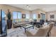 Bright living room featuring stylish furniture, modern fixtures, and a sliding glass door at 4288 Veraz St, Las Vegas, NV 89135