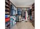 Spacious walk-in closet with custom shelving, hanging rods, and ample storage space at 4288 Veraz St, Las Vegas, NV 89135