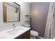 Bathroom features a modern vanity, framed mirror, floating shelves and neutral color palette at 4421 Halbert Ave, Las Vegas, NV 89110