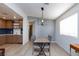 Cozy dining area with modern lighting, adjacent to the updated kitchen at 4421 Halbert Ave, Las Vegas, NV 89110