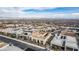 Neighborhood aerial view features mountain views and modern homes in the desert landscaping at 472 Sand Dune Arch St, Las Vegas, NV 89138