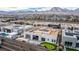 Aerial view shows a backyard with a putting green, pool and modern desert landscaping at 472 Sand Dune Arch St, Las Vegas, NV 89138