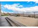 Backyard hardscape with putting green and city views at 472 Sand Dune Arch St, Las Vegas, NV 89138