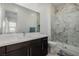 Modern bathroom featuring a marble shower, floating vanity, and a large mirror at 472 Sand Dune Arch St, Las Vegas, NV 89138