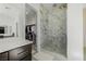 Bathroom featuring a walk-in closet, glass shower door, undermounted sink, and vanity at 472 Sand Dune Arch St, Las Vegas, NV 89138