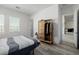 Bedroom featuring hardwood floors, and a view of two windows, and a closet with clothes at 472 Sand Dune Arch St, Las Vegas, NV 89138