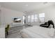 Brightly lit bedroom with a minimalist aesthetic, including outdoor views at 472 Sand Dune Arch St, Las Vegas, NV 89138