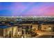 Las Vegas skyline view at sunset from rooftop of modern home at 472 Sand Dune Arch St, Las Vegas, NV 89138