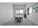 Dining room with a view of the city from sliding glass door at 472 Sand Dune Arch St, Las Vegas, NV 89138