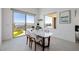 Bright dining room features a modern table, chairs, and sliding door with an incredible view at 472 Sand Dune Arch St, Las Vegas, NV 89138