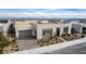 Modern home featuring neutral-toned brick, a flat roof, two car garage, and desert landscaping at 472 Sand Dune Arch St, Las Vegas, NV 89138