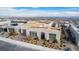 Stylish single-Gathering home with desert landscaping, a paved driveway, and modern architectural accents at 472 Sand Dune Arch St, Las Vegas, NV 89138