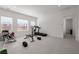 Large home gym featuring neutral tile floors, recessed lighting, and bright natural light at 472 Sand Dune Arch St, Las Vegas, NV 89138