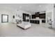 Open-concept living room featuring tile flooring, a modern sofa, and a kitchen at 472 Sand Dune Arch St, Las Vegas, NV 89138