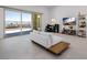 Living room featuring tile flooring, a modern sofa, and sliding doors to a patio with a view at 472 Sand Dune Arch St, Las Vegas, NV 89138