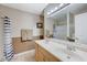 Bathroom with dual sinks, spacious mirror, and tiled floor at 478 Potomac St, Henderson, NV 89015