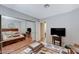 Bedroom featuring wood floors, mirrored closet doors, and a relaxing ambiance at 478 Potomac St, Henderson, NV 89015