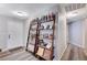 Inviting entryway featuring decor shelving, wood-look flooring, and a freshly painted white door at 478 Potomac St, Henderson, NV 89015