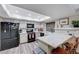 Modern kitchen with white countertops, black appliances, and a convenient breakfast bar at 478 Potomac St, Henderson, NV 89015