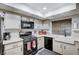 Bright kitchen featuring granite countertops, stainless steel appliances, and a farmhouse sink at 478 Potomac St, Henderson, NV 89015