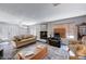 Bright living room with a decorative fireplace, and access to a patio through glass doors at 478 Potomac St, Henderson, NV 89015