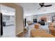 Open concept living space with seamless flow to a modern kitchen and a warm fireplace at 478 Potomac St, Henderson, NV 89015