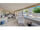 Inviting outdoor kitchen with seating, sink, and views of the surrounding landscape at 478 Potomac St, Henderson, NV 89015