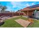 Expansive backyard features a patio area and solar panels, perfect for outdoor entertaining and sustainable living at 4932 Goldeneye Way, North Las Vegas, NV 89031