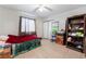 Bedroom with a ceiling fan, large windows, tile flooring, and ample natural light at 4932 Goldeneye Way, North Las Vegas, NV 89031