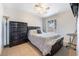 Bedroom with tile flooring, ceiling fan, window and dresser at 4932 Goldeneye Way, North Las Vegas, NV 89031