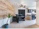 Dining area showcases plank accent wall, modern table, tile floors, and neutral paint at 4932 Goldeneye Way, North Las Vegas, NV 89031