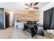 Dining area showcases plank accent wall, modern table, tile floors, and neutral paint at 4932 Goldeneye Way, North Las Vegas, NV 89031